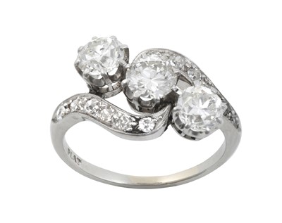 Lot 2226 - A Diamond Three Stone Twist Ring the central...
