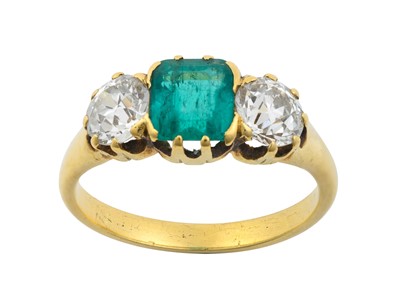 Lot 2291 - An Emerald and Diamond Three Stone Ring the...