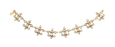 Lot 2288 - A Diamond Bracelet eight chain linked fleur-de-...