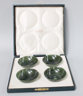 Lot 160 - A Cased Set of Four Chinese Spinach Jade Bowls,...