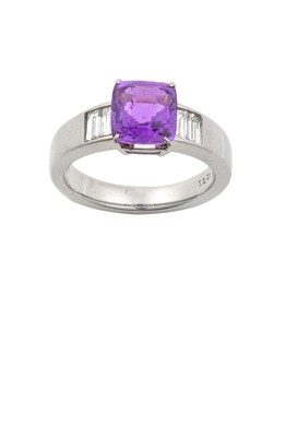 Lot 2262 - A Purple Sapphire and Diamond Ring the cushion...
