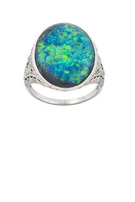 Lot 2244 - A Black Opal and Diamond Ring the oval black...