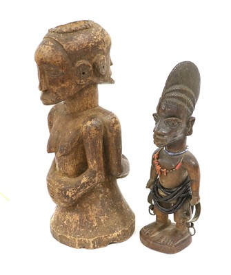 Lot 197 - A Yoruba Carved Wood Ibiji, standing with high...