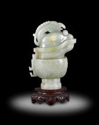 Lot 49 - ~ A Chinese Archaistic Celadon Jade Ewer and...