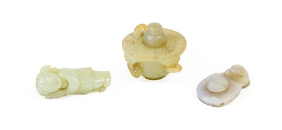 Lot 54 - A Chinese Jade Figure of a Boy, carrying a...