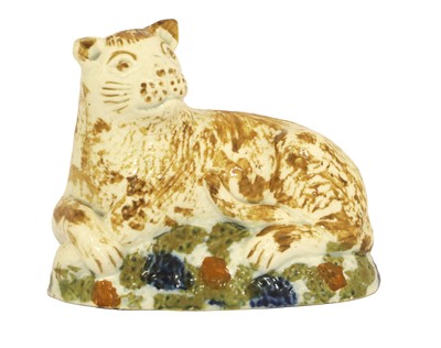 Lot 61 - A Pratt Ware Lioness, circa 1800, modelled...