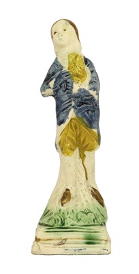 Lot 60 - A Pratt Ware Figure of a Youth, circa 1800,...