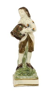 Lot 57 - A Pratt Ware Figure of a Youth Representing...