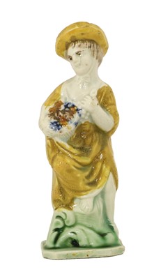 Lot 51 - A Pratt Ware Figure of a Lady Representing...