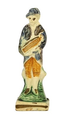 Lot 53 - A Pratt Ware Figure of a Hurdy Gurdy Player,...