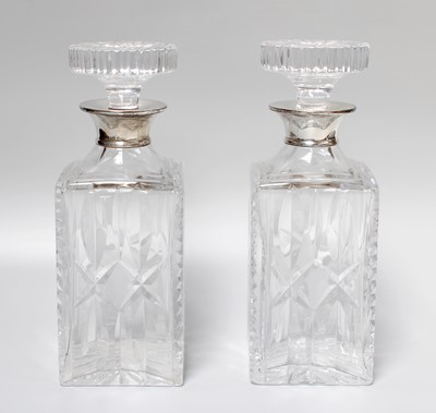 Lot 146 - A Pair of Silver Collared Decanters, 25cm high