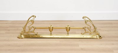 Lot 673 - An Arts & Crafts-Style Brass Fire Fender, the...