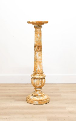 Lot 699 - A Siena Yellow and White-Veined Marble Column,...