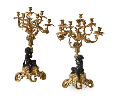 Lot 1128 - A Pair of French Gilt and Patinated Bronze...
