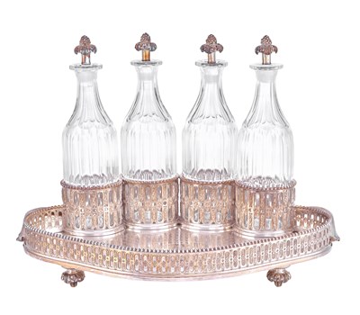 Lot 1022 - A French Silver Decanter-Stand and Four Silver-Mounted Cut-Glass Bottles