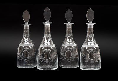 Lot 977 - Four Glass Magnum Decanters, in Regency style,...