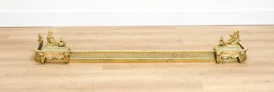 Lot 1051 - A French Louis XV-Style Brass Fire Fender, the...