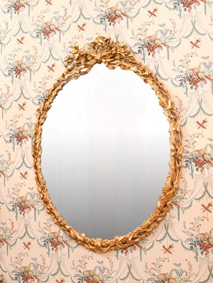Lot 352 - A Carved Giltwood and Gesso Oval Wall Mirror,...