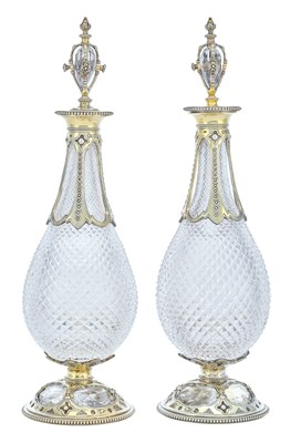Lot 810 - A Pair of Victorian Silver-Gilt Mounted Cut-Glass Flasks