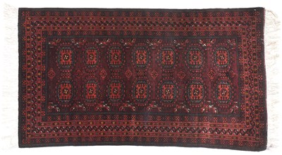 Lot 1124 - Baluch Rug Northeast Iran, Circa 1940 The deep...