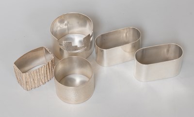 Lot 121 - Five Elizabeth II Silver Napkin-Rings,...
