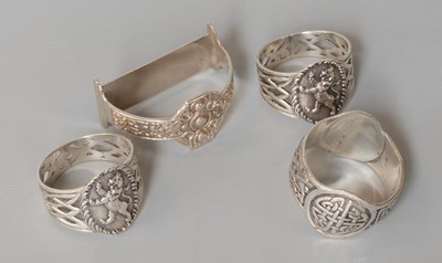 Lot 114 - Four Scottish Silver Napkin-Rings, comprising...