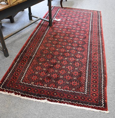 Lot 1259 - Baluch Rug, the honeycomb lattice field of...