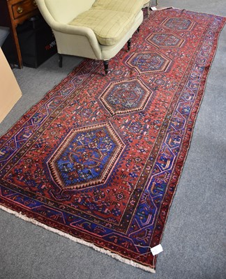 Lot 1111 - Karajah Long Rug, the field with five linked...
