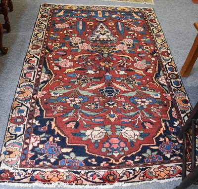 Lot 1106 - Bakhtiari Prayer Rug, the field with urn...