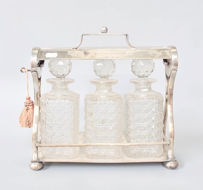 Lot 161 - A Victorian Silver Plate Three-Bottle Tantalus,...