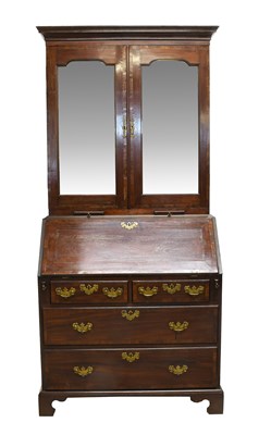 Lot 1393 - A George III Mahogany and Crossbanded Bureau...