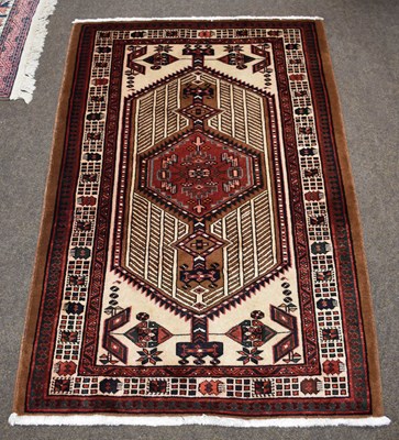 Lot 1268 - Sarab Rug, the ivory field with a central...