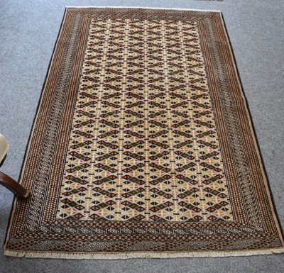 Lot 1105 - "Bukhara" Rug, the compartmentalised field of...