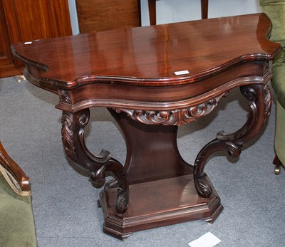 Lot 1185 - A Carved Mahogany Console Table, shaped front,...