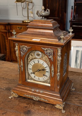 Lot 1279 - A Walnut Quarter Striking Table Clock, circa...