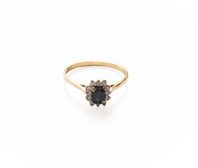 Lot 279 - An 18 Carat Gold Sapphire and Diamond Cluster...
