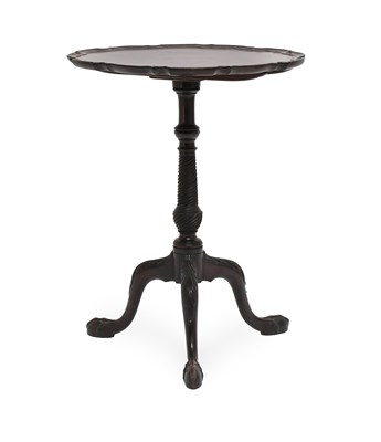 Lot 519 - A George III Style Carved Mahogany Tripod...