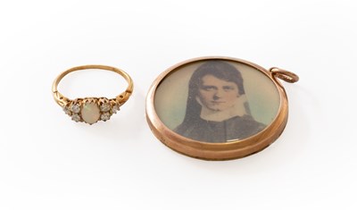 Lot 257 - An Opal and Diamond Ring, the oval cabochon...
