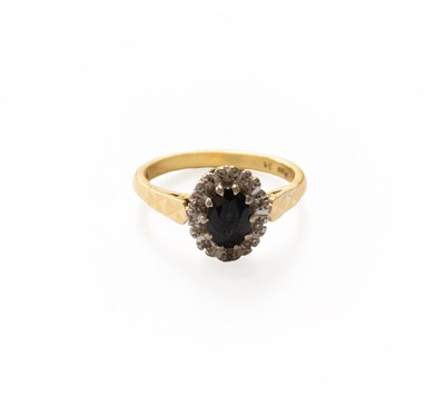 Lot 266 - An 18 Carat Gold Sapphire and Diamond Cluster...