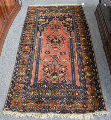 Lot 1267 - Anatolian Prayer Rug, the pale aubergine field...