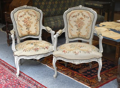Lot 1428 - A Pair of French Painted Fauteuils, with...