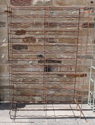 Lot 1251 - A Weathered Painted Metal Wine Rack, 102cm by...