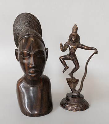 Lot 239 - An Indian Bronze Figure of a Deity, stood upon...