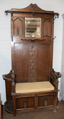 Lot 1343 - An Early 20th Century Carved Oak Mirrored Hall...