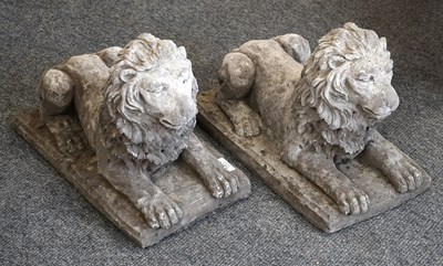 Lot 1377 - A Pair of Composition Recumbent Lions, 43cm