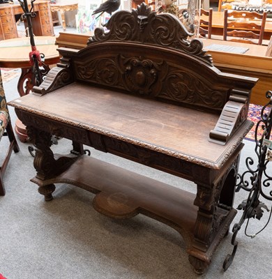 Lot 1439 - A Victorian Carved Oak Serving Table, with two...