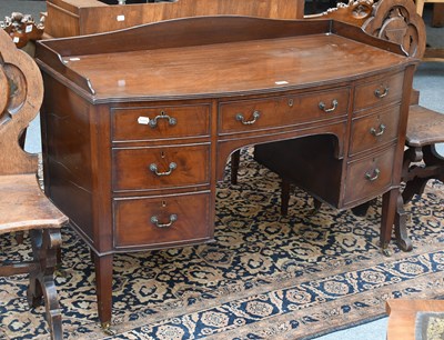 Lot 1451 - A George III Mahogany Writing Table, with bow...