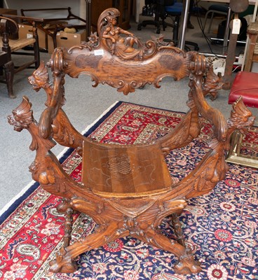 Lot 1241 - A Continental Carved Walnut Savonarola-Style...