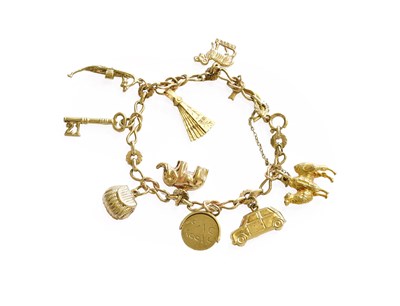 Lot 428 - A 9 Carat Gold Fancy Link Bracelet, suspending...