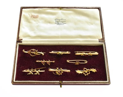 Lot 412 - Eight bar brooches, of varying designs and...